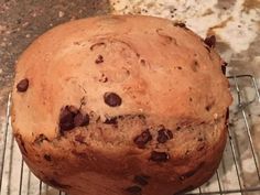 a loaf of chocolate chip bread on a cooling rack