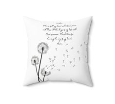 a white pillow with a dandelion design on the front, and a poem written in