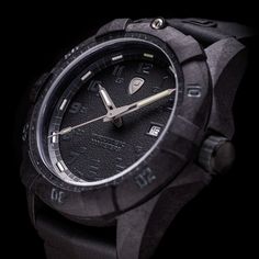 a close up of a watch on a black background