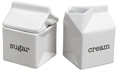 two white sugar containers with the words sugar and cream on them