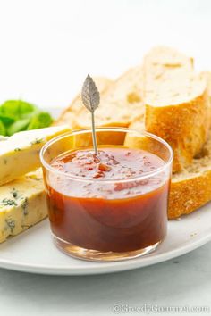 a plate with bread, cheese and ketchup on it