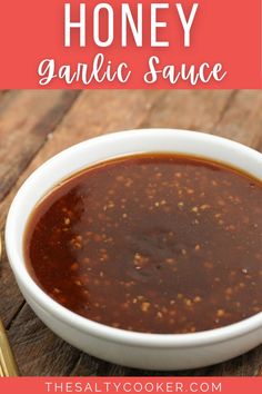 a bowl of homemade honey garlic sauce on a wooden table with text overlay that reads, how to make honey garlic garlic sauce