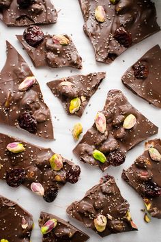 several pieces of chocolate with nuts and dried cherries