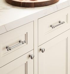 a cutting board sitting on top of a kitchen counter