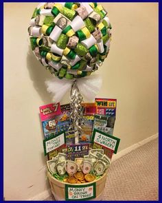 a basket filled with lots of money sitting on top of a floor next to a wall