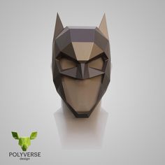 an origami cat mask is shown on a white surface with the word polyverse below it