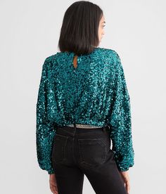 En Creme Sequin Dolman Top - Green Large, Women's Aqua Cropped fabric lined top Back button keyhole Elasticized waistband and cuffs Bust measures 32 on size small Body length 16 on size small. Shell/Lining: 100% Polyester. Hand wash cold. Do not bleach. Line dry. Iron low.. Measurements: Bust -Fullest part of bust with arms at sides. Waist -Circumference of natural waist: above belly button below rib cage. Hips -Standing with feet together fullest part of hips. WOMEN'S TOP SIZE CONVERSION CHART Green Sequin Tops For Fall, Green Sequined Long Sleeve Top, Green Long Sleeve Sequin Top, Dolman Top, Conversion Chart, Waist Circumference, Top For Women, Women Shirts Blouse, Rib Cage