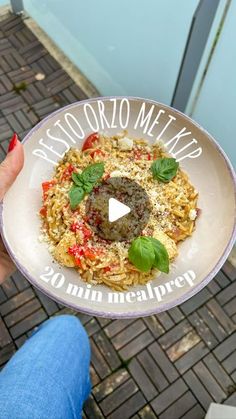 a person holding up a plate of food with the words mexico written in white on it