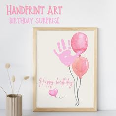 a pink handprint art birthday surprise with balloons