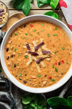 a white bowl filled with soup and garnished with croutons