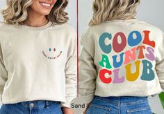 "Stay cozy and stylish in our Cool Aunts Club sweatshirt or hoodie. Featuring a trendy graphic design, it's the perfect gift for cool moms, aunts, and grandmas who love aesthetic clothes. Ideal for Christmas, Mother's Day, or any occasion. Order now and join the club! 📣 Please check all photos for details. 📣 Use \"Add message to Seller\" link on the checkout page to send a message or important details for your order. 📣 We use Bella Canvas and Gildan when we have a shortage of stocks. 📣 Our printing method is DTF, Premium Vinyl and Heat Press. ♥ HOW TO ORDER ♥ 1- Please, Check and Review all Photos. 2- Select your shirt type, shirt size, shirt color from drop down menus and Choose your quantity. 3- Choose Your TEXT Color. Please add your text color on to the personalization box if appli Trendy Crew Neck Sweatshirt For Birthday, Birthday Sweatshirt With Graphic Print In Relaxed Fit, Fall Birthday Sweatshirt With Graphic Print, Casual Birthday Sweatshirt With Lettering, Casual Sweatshirt With Lettering For Birthday, Graphic Print Sweatshirt For Birthday In Fall, Casual Graphic Print Sweatshirt For Birthday, Aunts Birthday, Trendy Graphic Design