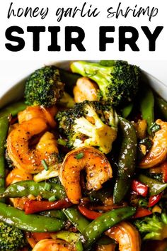 stir fry with shrimp, broccoli and peppers in a white bowl