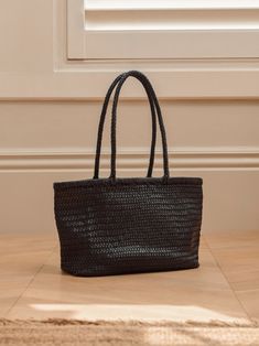 Created using exquisite hand woven leather, the Woven Leather Tote Bag perfectly combines minimalist elegance with practicality. Whatever the outing, whatever the day - put all your belongings in one place, and your valuables in the internal slip pocket for extra safety. Woven Leather Tote, Black Leather Tote Bag, Tote Bag Black, One Bag, Black Tote Bag, Leather Tote Bag, Leather Tote, Hand Woven, Hand Weaving