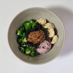 a white bowl filled with different types of food