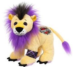 a stuffed animal with purple hair on it's head and legs, standing in front of a white background