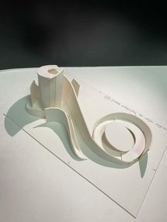 a white sculpture sitting on top of a table