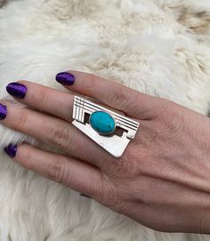 An alluring Sleeping Beauty Turquoise Ring that is accented with beautiful contemporary Sterling Silver. Lightweight Statement Ring. Modern Turquoise Sterling Silver Jewelry, Modern Blue Turquoise Gemstone Ring, Modern Turquoise Ring As Gift, Modern Turquoise Ring For Gift, Modern Turquoise Ring For A Gift, Modern Turquoise Anniversary Ring, Modern Turquoise Gemstone Ring, Modernist Turquoise Jewelry Gift, Turquoise Art Deco Rings For Gift