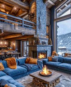 a living room filled with furniture and a fire place in the middle of a room