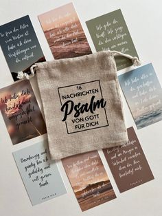 a bag with some words on it sitting in front of many other cards and tags