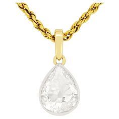 A stunning 1.75 carat diamond is the focus of this Victorian necklace. The diamond is wonderfully cut into an old pear shape, and would have been cut by hand at the time. It is H to I in colour and SI1 clarity, and is rub over set in platinum with lovely milgrain edging. The bail and chain are made of 15 carat yellow gold, a type of gold popular in the Victorian era. This stunning diamond pendant was made by hand in the 1880s. Gemstone: Diamond Stone Shape: Old Pear Cut Carat Weight: 1.75 Colour Victorian Necklace, Types Of Gold, Pear Cut Diamond, Pear Cut, Diamond Stone, Pear Shape, Diamond Pendant, Jewelry Necklace Pendant, Diamond Necklace