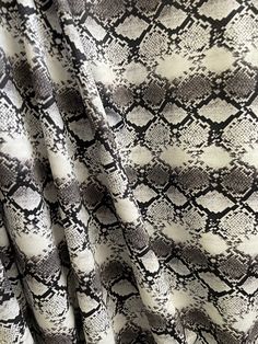 a white and black snake skin print fabric