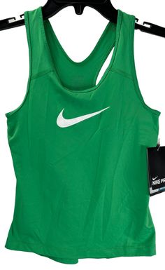 Nike Girl's Pro Cool Training Sport Racerback Tank Top, Green, Small UPC: 640135352560 Style #: 727974 Brand: Nike  Type: Tank Top Color: Red Size: Large Department: Men's  Neckline: Round Neck Sleeves: Sleeveless Closure: Pull Over Pattern: Solid Material: 100% Polyester Made in China Machine Washable MSRP is $45.00 but we sell it for $24.99 ♥♥♥ CLICK HERE TO SEE MY OTHER ITEMS FOR MORE AMAZING DEALS!!!! ♥♥♥ Green Sportswear Tank Top, Nike Sporty Racerback Tops, Nike Racerback Tops For Sports Events, Green Tops For Sports Season, Green Racerback Tank Top For Sportswear, Nike Green Tops For Gym, Nike Green Gym Tops, Nike Green Tops For The Gym, Green Nike Tops For Sports Season