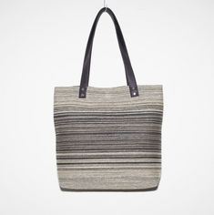 "A practical bag for everyday wear. This handmade shoulder bag is made of upholstery fabric and lined with beige raincoat fabric. The bag is designed with a spacious interior that closes with a magnetic closure. Inside it has one open pocket and one zipped pocket. The cork handles are long enough to carry in the hand or on the shoulder. Clean by hand washing with warm water and mild soap solutions. Rinse with water to prevent dirt from sticking to the fabric. Air drying. SIZE: Height: 33cm (13.05\") Width:  39.5cm  (15.45\") Depth:  12.00cm   (4.45\") Length of handles: 60 cm (23.45\") Each piece that you will find in the collection is made one at a time, with carefully selected materials, and most styles are created in very small runs according material availability. Handmade in our Most Casual Canvas Straw Bag For Daily Use, Natural Bucket Shoulder Bag For On-the-go, Taupe Shoulder Bag For Travel, Natural Color Bucket Shoulder Bag For On-the-go, Casual Beige Tote Shoulder Bag, Casual Beige Satchel With Double Handle, Beige Crossbody Shoulder Bag With Leather Handles, Beige Leather Handle Crossbody Shoulder Bag, Beige Leather Handles Crossbody Shoulder Bag