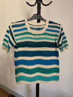 Summer sweater, in natural cotton, blue and green/ecru stripes. Short sleeves. Round neckline. Size S (38). Other colors or sizes on order. Spring Knit Tops With Horizontal Stripes, Striped Cotton Crew Neck Knit Top, Striped Cotton Knit Top With Crew Neck, Fitted Striped Crew Neck Knit Top, Fitted Striped Knit Top With Crew Neck, Knit Crew Neck Sweater With Horizontal Stripes, Knit Sweater With Horizontal Stripes And Crew Neck, Striped Crew Neck Sweater For Spring, Striped Knit Tops