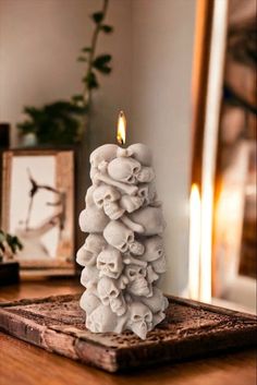 a white candle sitting on top of a wooden table