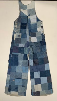 Amazing hand made quilted denim overalls composed entirely of various denim jeans materials. These are really amazing to be redundant, I have seen attempts at projects like these but never a pair this complete and concise. The patches are taken from a large variety of jeans, Levis, Lee, Wrangler, Calvin Klein etc. These are lined with a light cotton material similar to bed sheet. Waist-36, 18 across measured lying flat. Inseam-28 Rise from crotch to top of bib-23 Strap length-20 approximate and Denim Blue Patchwork Cotton Overalls, Vintage Denim Overalls With Patchwork, Indigo Patchwork Cotton Jeans, Denim Patchwork Jumpsuit Overalls, Patchwork Overalls, Quilted Denim, Quilted Patchwork, Dream Jeans, Patchwork Denim