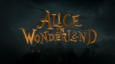 the title for alice in wonderland, written on a dark background with buildings and fog