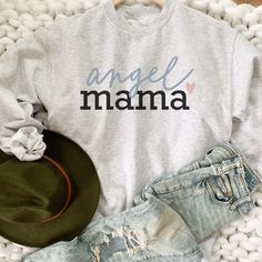 Angel Mama Heart Sweatshirt. HOW TO ORDER T-SHIRT 1- Please, Check and Review all Photos. 2- Choose your size from the drop-down menu 3- Select Your Shirt Color from Drop-down 2 4- Repeat for each shirt ordered 8 oz.(US) 13.5 oz.(CA), 50/50 preshrunk cotton/polyester Heather colors- 90/10 airlume combed and ringspun cotton/polyester Deep Heather Grey- 3.6 oz., 65% Polyester/35% Ring-Spun cotton Double-lined hood with color-matched drawcord Double needle stitching at shoulder, armhole, neck, wais Angel Mama, Pretty Sweatshirts, Mama Hoodie, Birthday Sweatshirt, Womens Sweatshirts, Mom Hoodies, Retro Sweatshirts, Mama Gifts, Mama Shirts