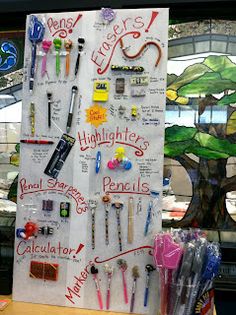 a bulletin board with writing on it in front of a tree and stained glass window