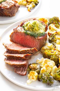 two white plates topped with steak and broccoli