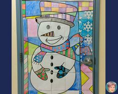 a snowman painted on the front door of a building