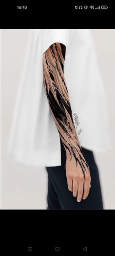 a man's arm with black ink on it