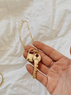 This beautiful lock and key set comes together but can be separated or kept together, the key has a set of numbers and the phrase 'BE BRAVE' and the lock as the word 'BELIEVE' printed on itThe dainty link chain is 18 inches long I personally source and assemble all my Jewelry Pieces with love in Miami Florida XOXO 18k Gold Filled Chain All of our jewelry is 100% hypoallergenic, Lead & Nickel Free. Those with allergies do not need to worry about developing an allergic reaction. My standard sh Gold Jewelry With Lobster Clasp For Birthday, Key Pendant Necklace Gold, Heart And Key Necklace, Classic Key Necklace, Gold Lock And Key Necklace, Gold Key Necklace, Elegant Heart-shaped Key Jewelry, Lock And Key, Key To My Heart