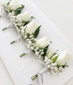 Groom – White rose with baby’s breath and greenery 
Groomsmen – Pink or Purple rose with baby’s breath and greenery (rose colour dependent on colour of bridesmaid dresses & groomsmen’s ties - colour to match). Wedding Bouquet Classic Elegant, Classic Boutonniere Wedding, White Rose Buttonhole, White Roses And Gypsophila, Wedding Button Holes, Groomsmen Pink, White Buttonhole, Buttonholes Wedding