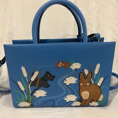 Radley London Blue Leather Handbag With Rabbit, Scottie Dog And Flower Appliqus. It Has A Shoulder Strap As Well As Handles. Designer Blue Handheld Satchel, London Bags, Radley London, Scottie Dog, London Blue, Leather Handbag, Blue Leather, Shoulder Bags, Shoulder Strap