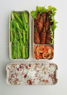 two trays filled with meat, rice and veggies next to each other