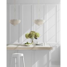 two white vases sitting on top of a wooden table next to a bar stool