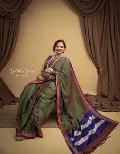 a woman in a green and blue sari