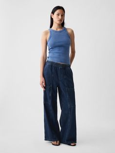 Fit: A full-length high rise jean that's loose throughout.  Finishes with a relaxed wide leg.  Fabric: 95% Cotton, 5% Recycled Cotton.  Stretch: No Stretch Jeans.  Authentic denim that gets better with every wear.  Made to wear all day & break in over time. ​ Rise: High Rise Skirt.  Look: A loose wide-leg utility jean in a dark indigo wash.  Details: Elasticized waist, front slant pockets, side cargo pockets, & back patch pockets.  Responsibly Made: This pair of jeans is part of our water-saving High Rise Skirt, Streetwear Accessories, Model Inspo, Loose Fit Jeans, Dark Indigo, Gap Pants, Break In, Denim Outfit, High Rise Jeans