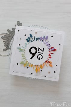 a close up of a card with the number nine on it and an ornament