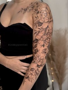 a woman with flowers on her arm and chest