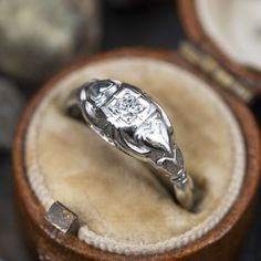 an antique diamond ring in a wooden box