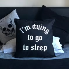 two pillows that say i'm dying to go to sleep on a couch next to each other