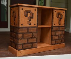 a wooden cabinet with drawers made out of wood blocks