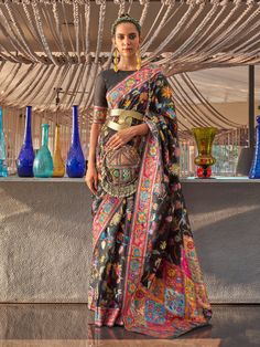 Get into the best version of yourself with this black colored moda silk handloom saree crafted with woven floral motifs all over enhanecd by distinctive border and pallu detail. Accompanied by a matching colored modal silk blouse. The unstitched blouse can be customized upto 44 inches. Do Note: All the accessories shown are for styling purpose only. Slight color variation may occur due to photographic reasons. Fall and Pico : Done Drapping Saree(Ready to wear) : On Request Extra Charges Occasion Drapping Saree, Dhoti Saree, Handloom Weaving, Party Sarees, Handloom Fabric, Black Saree, Party Kleidung, Art Silk Sarees, Wear Saree