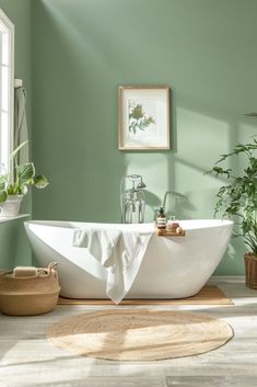 a bathroom with green walls and a white bathtub in the middle of the floor